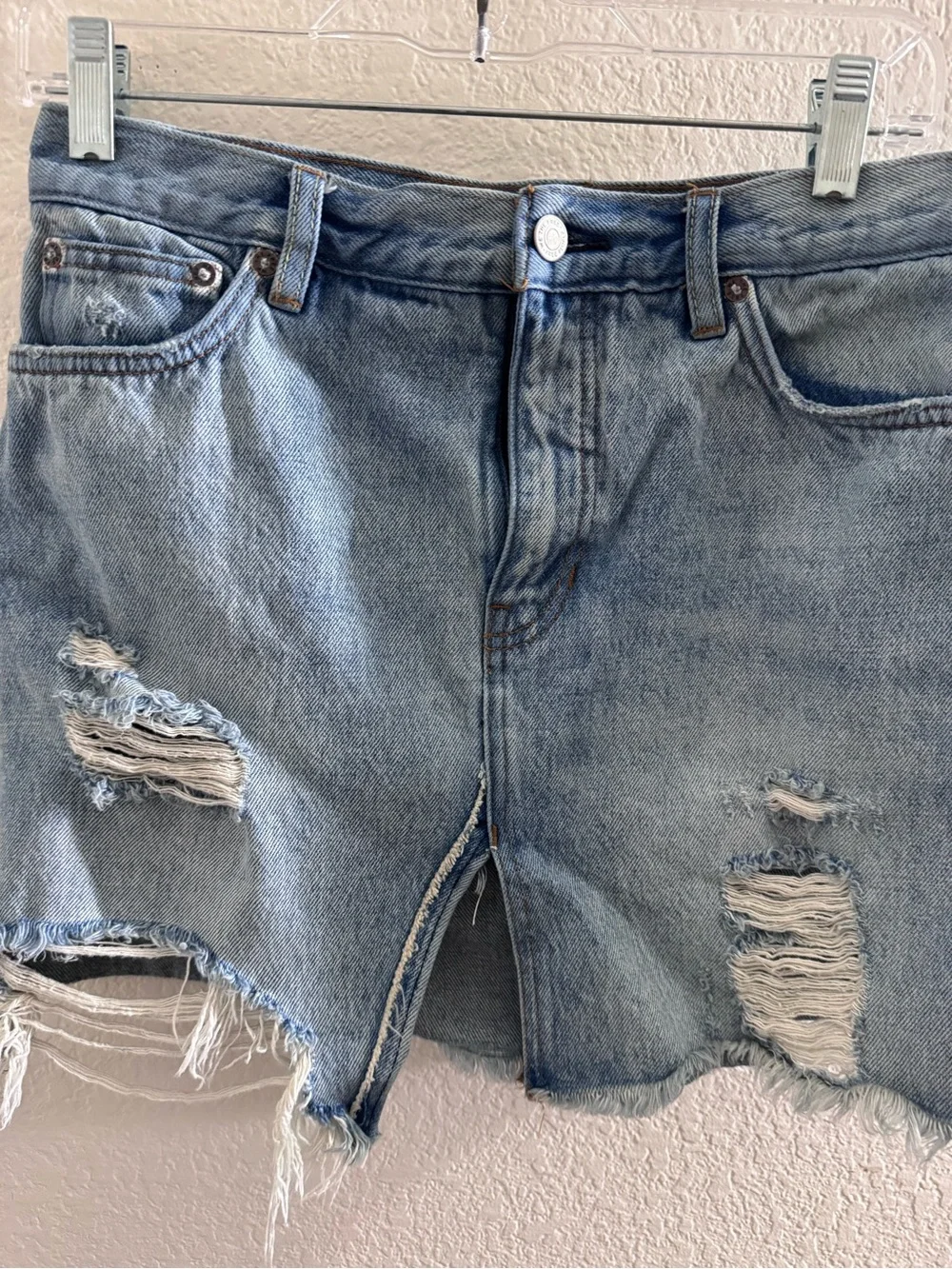 Free People We the Free Distressed Denim mini skirt